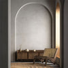 Epoca Ottocento lime wash paint Modern interior with wooden chair and sideboard against a gray wall.